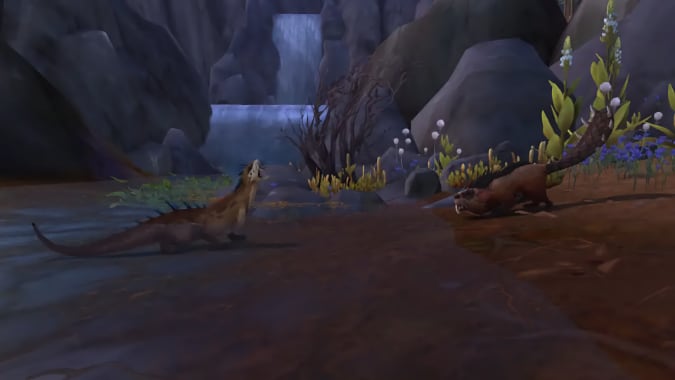 An ottuk and a spiked beaver yell at each other on a riverbank.