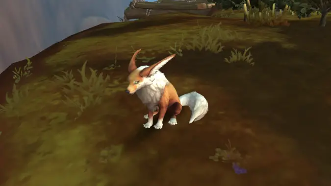 Fox sitting on a dirt patch in World of Warcraft Razorwind Shores
